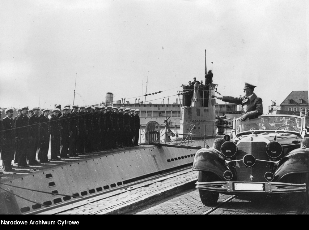 Adolf Hitler salutes a submarine crew from his car in Wilhelmshaven